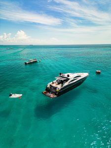 boat cruising on calm summer waters in Playa del Carmen