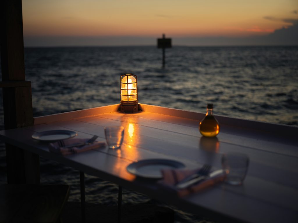 candlelit table setup for two on a Playa del Carmen yacht